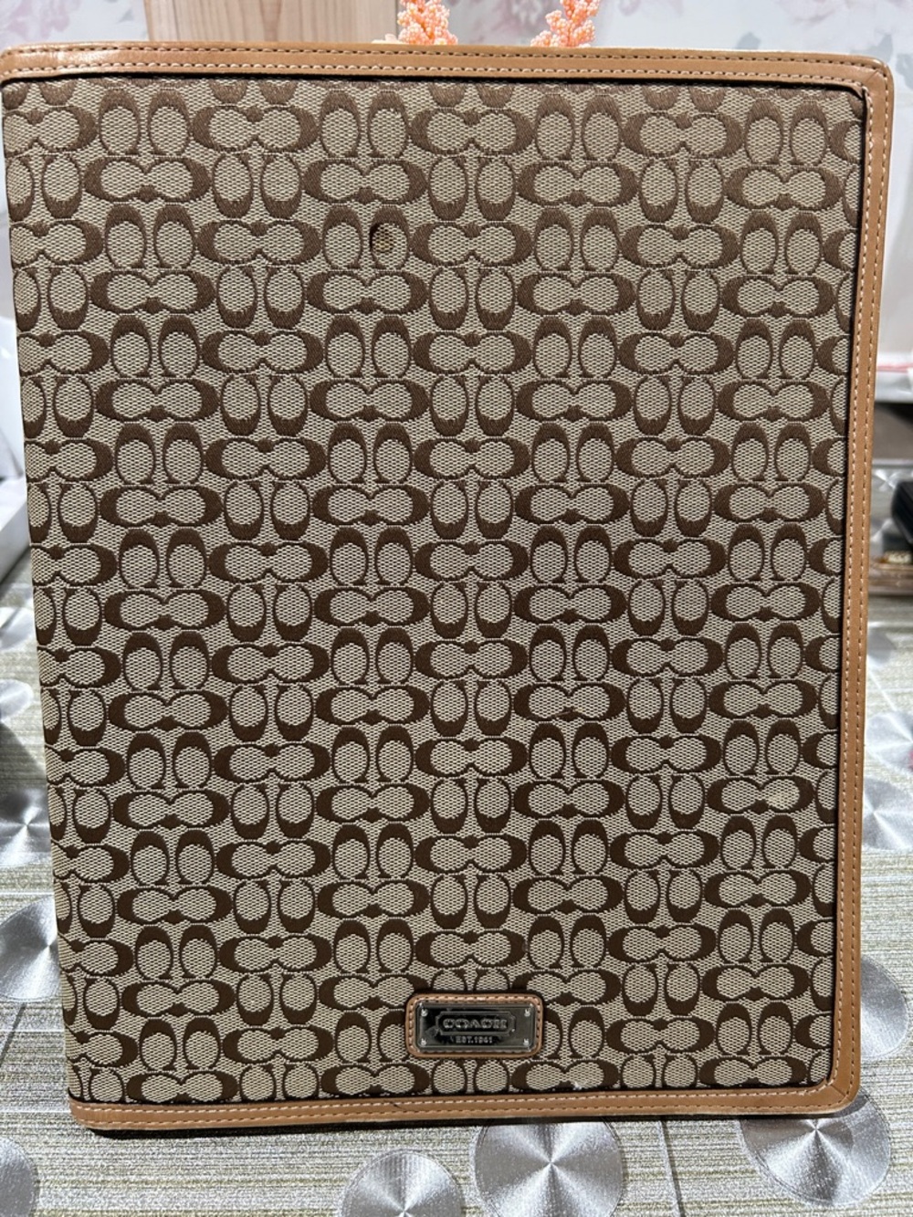 Coach Signature Portfolio in Brown and Tan.